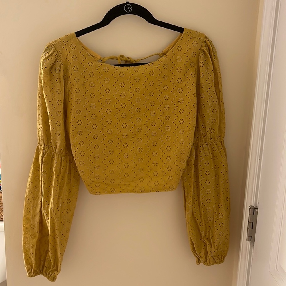 Yellow cropped top. Can be adjusted and tied in back